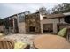 Outdoor stone patio with seating and a large stone fireplace, perfect for entertaining at 4586 Cr 696, Webster, FL 33597