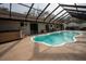 Private screened in pool area with spa and view of the house at 4586 Cr 696, Webster, FL 33597