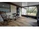 Enclosed porch with wood flooring and outdoor views at 4586 Cr 696, Webster, FL 33597