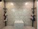 Step-in shower featuring stone-look tile and corner shelving at 4586 Cr 696, Webster, FL 33597