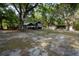 Large lot with basketball hoop, shed, trailer, and trees at 4586 Cr 696, Webster, FL 33597