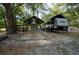 View of trailer and covered storage with shed in large grassy yard at 4586 Cr 696, Webster, FL 33597