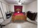 Bedroom with light wood floors and accents, light-colored walls, and decorative furniture at 5835 Talavera St, Orlando, FL 32807