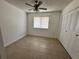 Bedroom with tile floor, closet, and a window letting in natural light, blank canvas ready for personal touch at 5835 Talavera St, Orlando, FL 32807