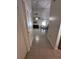 Inviting hallway with tile floors leading to the dining area and living room with lots of natural light at 5835 Talavera St, Orlando, FL 32807
