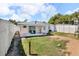 Spacious fenced backyard with a patio and plenty of room for recreation at 1043 Pineview Pl, Lakeland, FL 33801
