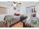 Well-lit bedroom features hardwood floors, closet and a large window at 1043 Pineview Pl, Lakeland, FL 33801
