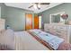 Comfortable bedroom featuring a large bed, dresser, and natural light at 1043 Pineview Pl, Lakeland, FL 33801