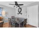Cozy dining area features a dark wood table set perfect for casual Gathering meals at 1043 Pineview Pl, Lakeland, FL 33801