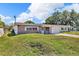 A charming brick home with a one-car garage and a well-manicured lawn at 1043 Pineview Pl, Lakeland, FL 33801