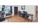 Office space with wood floors, neutral decor, desks, and office chairs at 1043 Pineview Pl, Lakeland, FL 33801