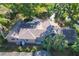 Aerial view of the home showcasing its roof, landscaping, and proximity to surrounding greenery at 1905 Seminole Trl, Lakeland, FL 33803