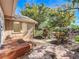 Inviting backyard space with brick patio and walkway, enhanced by lush landscaping and mature trees at 1905 Seminole Trl, Lakeland, FL 33803