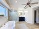 Bright bathroom with a soaking tub, a shower, modern fixtures, a vanity sink, and hardwood floors at 1905 Seminole Trl, Lakeland, FL 33803