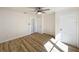 Bedroom featuring hardwood floors, a ceiling fan, and a closet at 1905 Seminole Trl, Lakeland, FL 33803