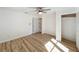 Bedroom featuring hardwood floors, a ceiling fan, and a closet at 1905 Seminole Trl, Lakeland, FL 33803