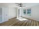 Bright bedroom featuring hardwood floors, a closet, and a window providing natural light at 1905 Seminole Trl, Lakeland, FL 33803
