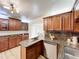 Spacious kitchen with granite countertops, stainless dishwasher and ample cabinet space at 1905 Seminole Trl, Lakeland, FL 33803