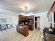 A well lit kitchen with custom cabinets, granite countertops and stainless steel appliances at 1905 Seminole Trl, Lakeland, FL 33803