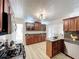 Gourmet kitchen features a gas range, granite counter tops, stainless appliances and ample cabinets at 1905 Seminole Trl, Lakeland, FL 33803