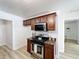A well lit kitchen featuring granite countertops, stainless appliances and custom wood cabinets at 1905 Seminole Trl, Lakeland, FL 33803