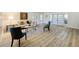 Inviting living room with stylish decor, comfortable seating and wood-look flooring at 1905 Seminole Trl, Lakeland, FL 33803