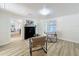 Bright living room features sleek fireplace, contemporary seating, and wood-look floors at 1905 Seminole Trl, Lakeland, FL 33803