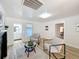 A bright living room features contemporary seating, wood-look floors, and wainscoting at 1905 Seminole Trl, Lakeland, FL 33803