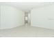 Expansive living room with bright white floors and walls at 2430 Slippery Rock St, Auburndale, FL 33823