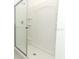 Clean, modern bathroom with glass-enclosed shower and built-in shelves at 2446 Slippery Rock St, Auburndale, FL 33823