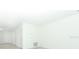Bright, freshly painted living room with recessed lighting and a modern, minimalist aesthetic at 2446 Slippery Rock St, Auburndale, FL 33823