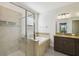 Bathroom features a glass-enclosed shower, tub, and granite countertop vanity at 8983 Azalea Sands Ln # 8983, Davenport, FL 33896