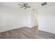 Bright bedroom featuring a ceiling fan, neutral walls, and modern wood-look flooring at 8983 Azalea Sands Ln # 8983, Davenport, FL 33896