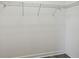 Walk-in closet features built-in wire shelving and neutral walls at 8983 Azalea Sands Ln # 8983, Davenport, FL 33896
