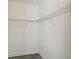 Walk-in closet with wire shelving for organized storage of clothes and accessories at 8983 Azalea Sands Ln # 8983, Davenport, FL 33896