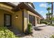 Close-up of a townhome's garage and entry showcasing the paver driveway at 8983 Azalea Sands Ln # 8983, Davenport, FL 33896