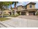 Inviting exterior showcases a three-car garage with brick-paved driveway, mature landscaping, and a well-maintained lawn at 8983 Azalea Sands Ln # 8983, Davenport, FL 33896