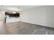 Bright living room showcases the open floor plan and modern lighting that accents the gray vinyl flooring at 8983 Azalea Sands Ln # 8983, Davenport, FL 33896