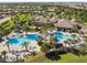 Aerial view of a community pool and clubhouse surrounded by manicured grounds at 8983 Azalea Sands Ln # 8983, Davenport, FL 33896
