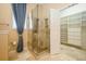 Bathroom features an elegant glass shower and a walk-in closet with custom shelving at 1002 Periwinkle Ct, Celebration, FL 34747