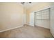 Bedroom with an open closet, hard wood flooring, and neutral walls with ceiling fan at 1002 Periwinkle Ct, Celebration, FL 34747