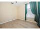 Bright bedroom with wood floors, a large window, and modern ceiling fan, providing a welcoming and stylish space at 1002 Periwinkle Ct, Celebration, FL 34747