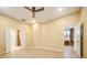 Bright bedroom with wood floors and multiple doorway access to other rooms at 1002 Periwinkle Ct, Celebration, FL 34747