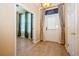 Inviting entryway featuring wood floors, neutral walls, and a stylish exterior door, enhanced by natural light at 1002 Periwinkle Ct, Celebration, FL 34747