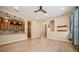 Open-concept area between the living room and kitchen with a breakfast bar and wood-style flooring at 1002 Periwinkle Ct, Celebration, FL 34747