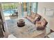 Cozy living room with pool view, comfortable seating, and stylish decor at 1802 Royal Ridge Dr, Davenport, FL 33896