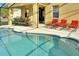 Inviting pool and deck with lounge chairs and outdoor seating area under the lanai at 1802 Royal Ridge Dr, Davenport, FL 33896