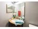 Cozy bathroom featuring a stylish vanity with granite countertop and a well-lit mirror at 319 Bailey Cir, Davenport, FL 33897