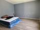 Simple bedroom with wood flooring and space for personalization to make it a home at 319 Bailey Cir, Davenport, FL 33897