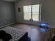 Unfurnished bedroom with laminate wood floors, bright window and ample light at 319 Bailey Cir, Davenport, FL 33897